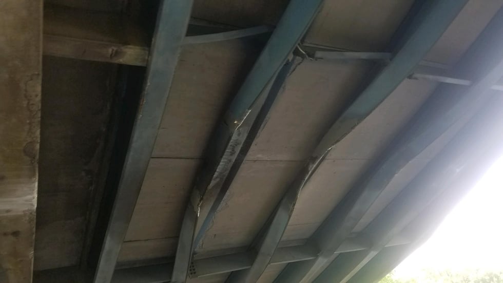 An over sized load on a tractor trailer crashes into the overpass on I-26 near the College...