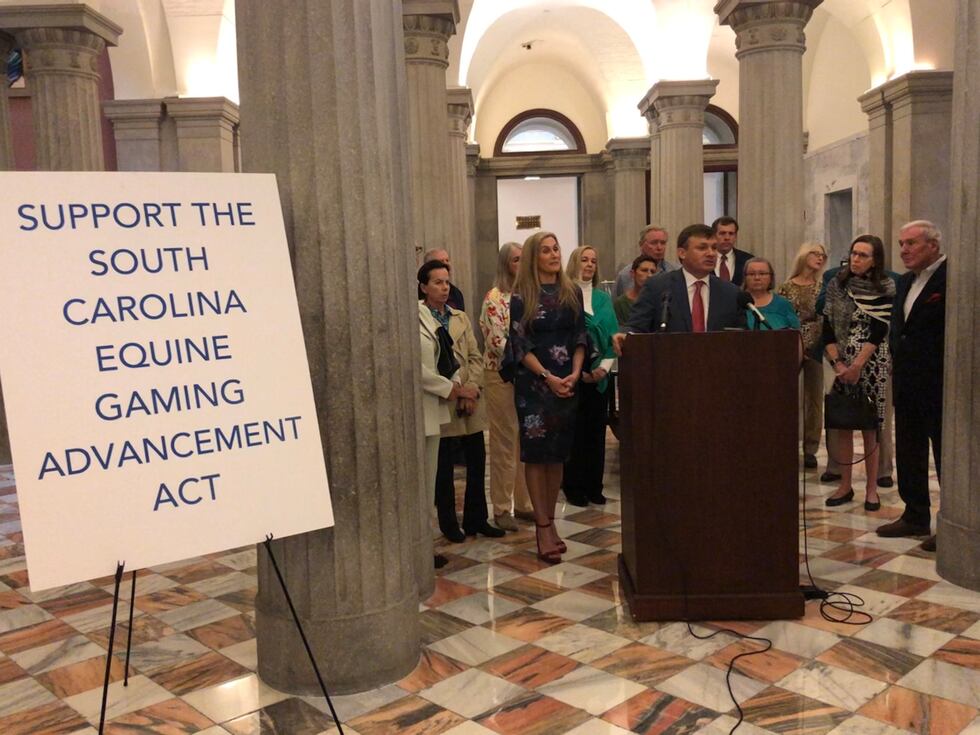 Rep. Russell Ott, D – Calhoun, speaks during a news conference at the State House on March 8,...