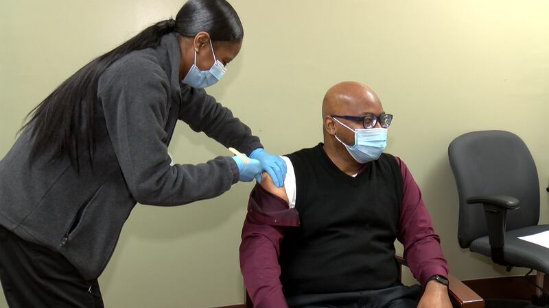 Charleston County School Board Chair Rev. Dr. Eric Mack received the first dose of the...