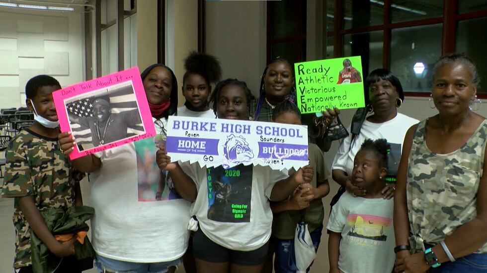 Members of Olympian and Charleston native Raven Saunders’ family celebrate after Saunders...