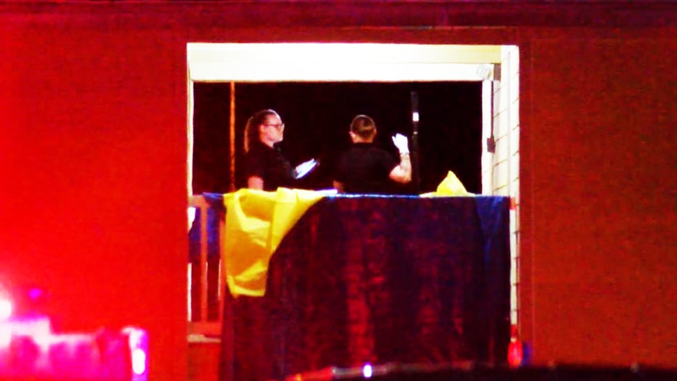 Emergency crews at the apartment complex after officers reported finding two male subjects...