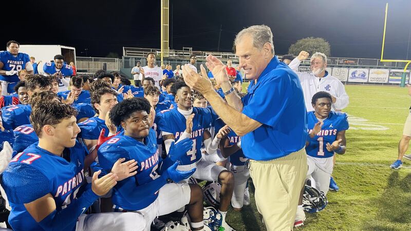 J.T. Curtis celebrates win No. 621 with his players. (Source: Garland Gillen)