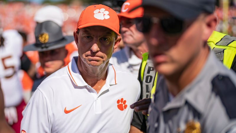 Clemson head coach Dabo Swinney walks off the field after losing to Florida State in overtime...