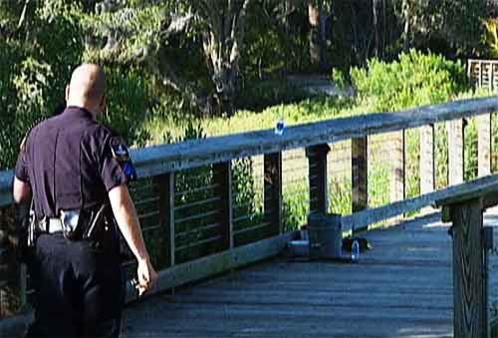 Police officer in the area of River Landing Drive after remains were found Thursday afternoon.