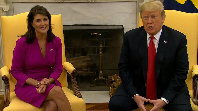 Former U.N. Ambassador Nikki Haley, left, is shown with former President Donald Trump in this...