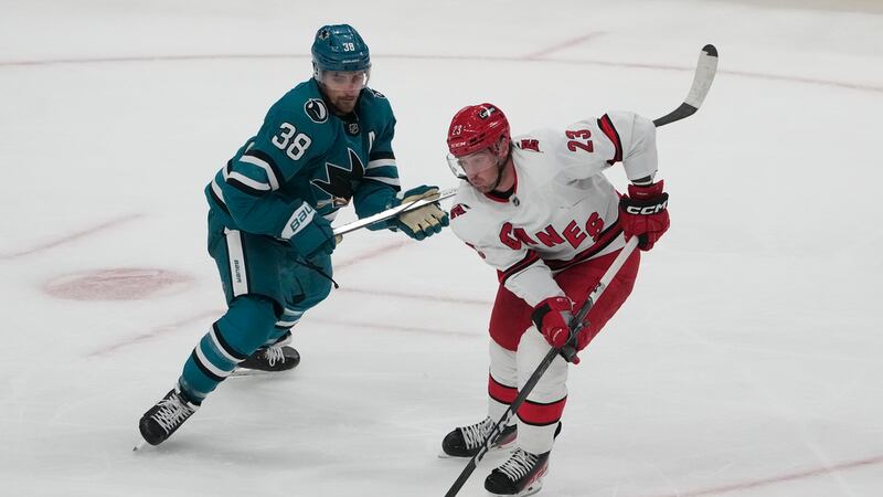 Carolina Hurricanes defenseman Dmitry Orlov skates against San Jose Sharks defenseman Mario...