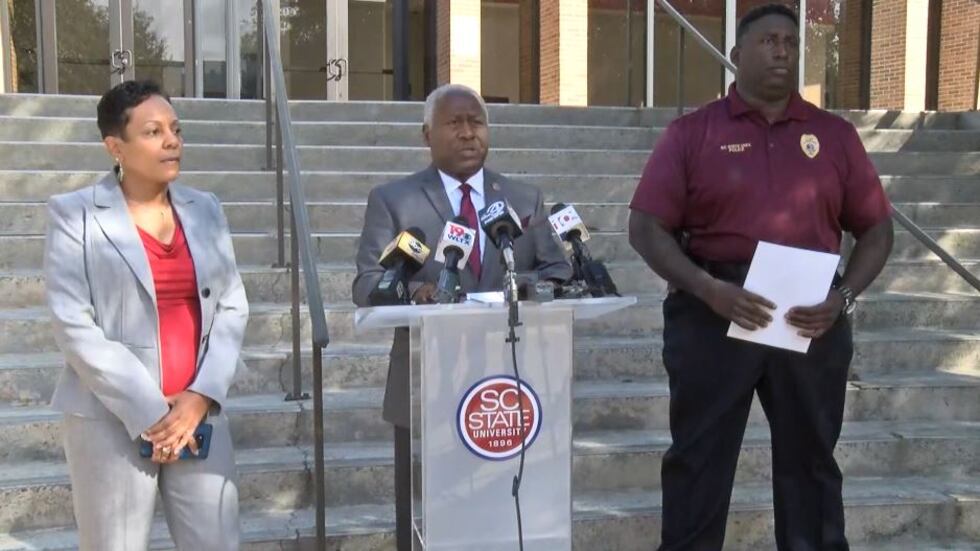 South Carolina State University President James Clark, center, spoke to reporters about an...