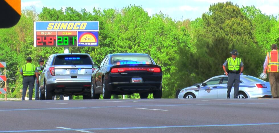 Highway Patrol and emergency crews directing traffic Thursday evening on the College Park Road...