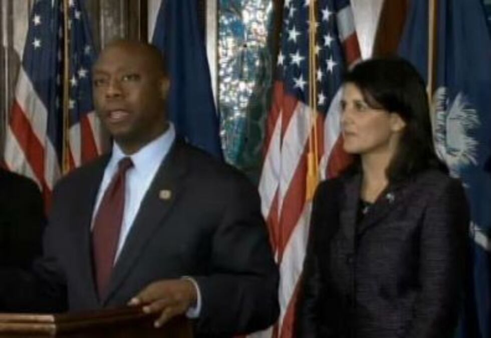 Rep. Tim Scott addresses the media, alongside Gov. Haley.