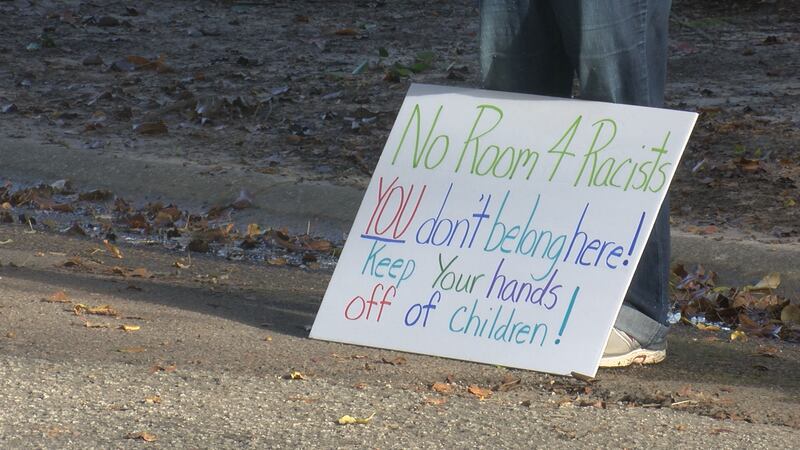 About 25 people gathered in a neighborhood in College Park Saturday to protest against a woman...