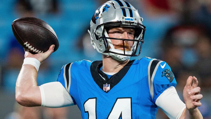 FILE - Carolina Panthers quarterback Andy Dalton (14) passes the ball against the Detroit...